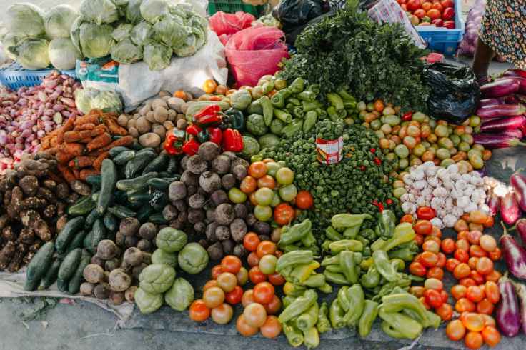 different vegetables in pile at street market